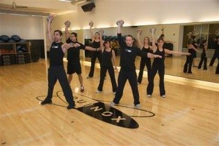 Instructor teaches kettlebell class at Equinox Fitness in Chicago